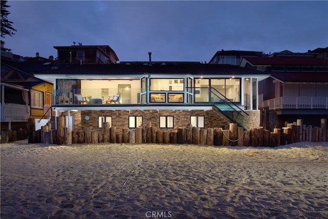 rear view of house with a balcony