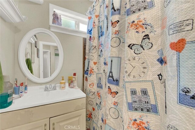 bathroom with vanity and walk in shower