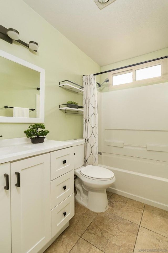 full bathroom featuring shower / bathtub combination with curtain, tile patterned flooring, vanity, and toilet