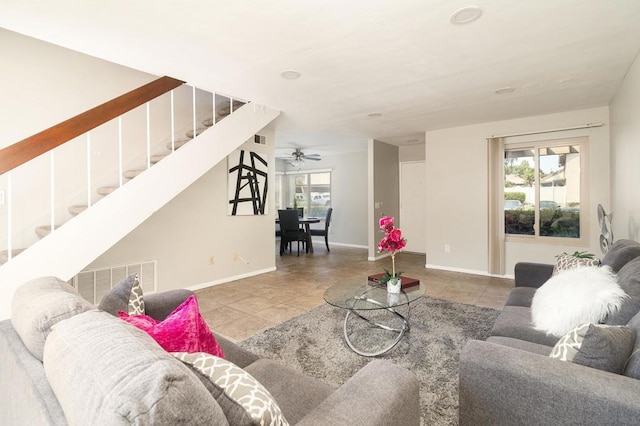 living room featuring tile patterned flooring and ceiling fan