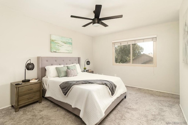 bedroom with light colored carpet and ceiling fan