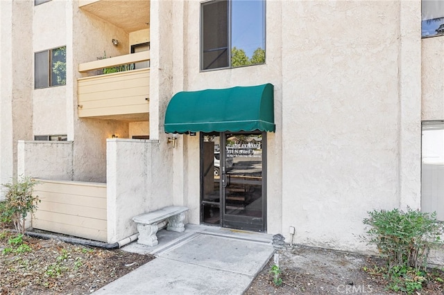 property entrance with a balcony