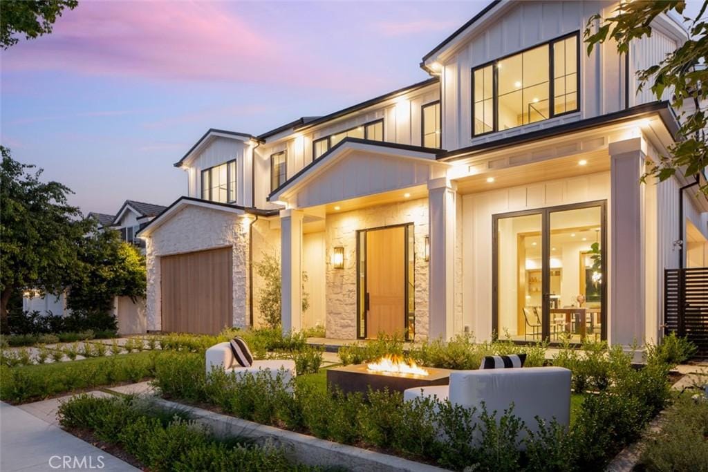 view of front of house featuring an outdoor fire pit