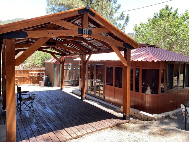 wooden terrace featuring a gazebo