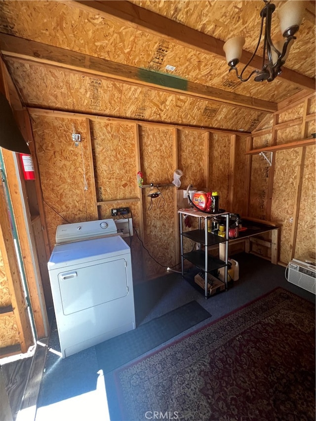 laundry area featuring washer / clothes dryer and a wall mounted air conditioner