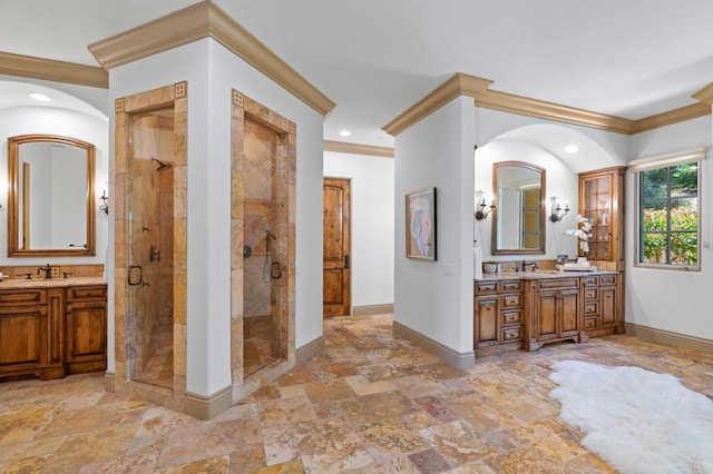 bathroom featuring vanity, crown molding, and an enclosed shower