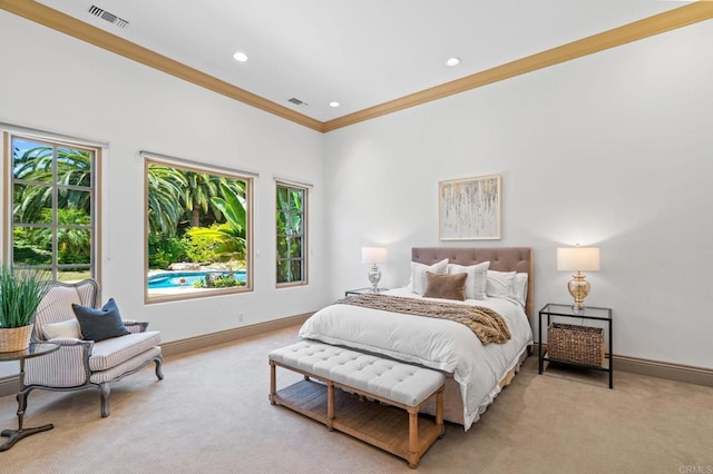 carpeted bedroom featuring crown molding