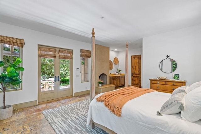 bedroom featuring access to outside and french doors