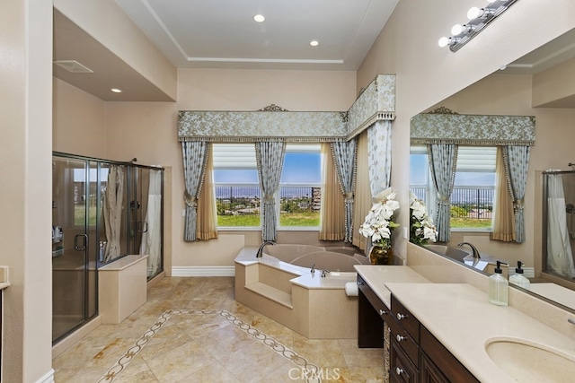 bathroom featuring tile patterned floors, vanity, and separate shower and tub