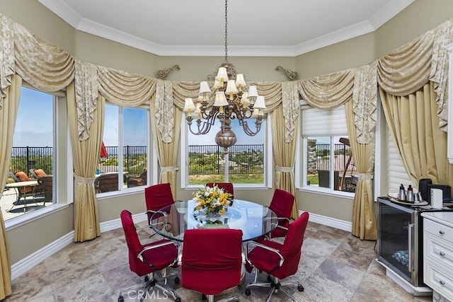 dining room with an inviting chandelier and ornamental molding