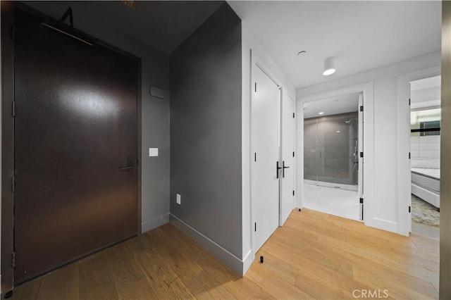 corridor featuring hardwood / wood-style flooring