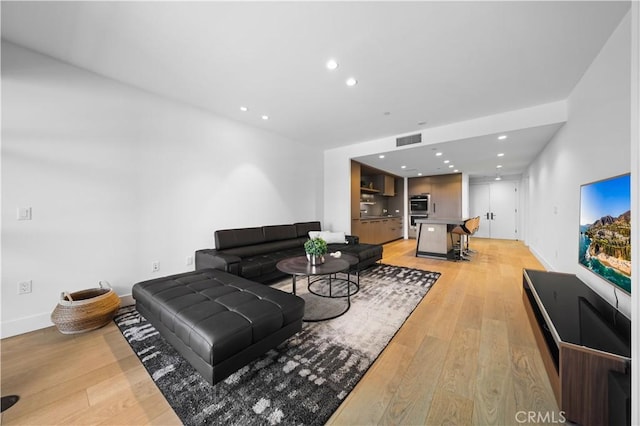 living room with light hardwood / wood-style floors