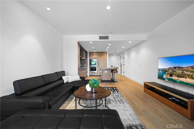 living room with light wood-type flooring