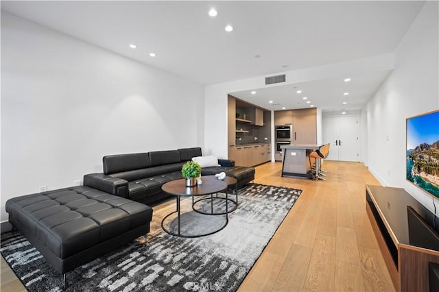 living room with light hardwood / wood-style floors