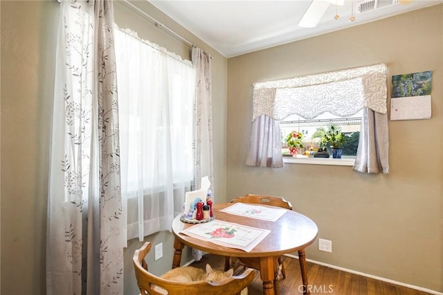 dining room featuring hardwood / wood-style floors and ceiling fan