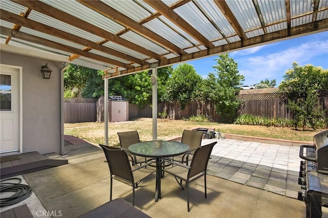 view of patio / terrace featuring a storage unit