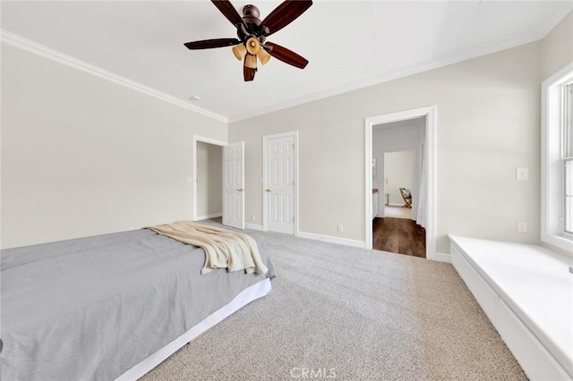 unfurnished bedroom featuring carpet flooring, ceiling fan, and crown molding