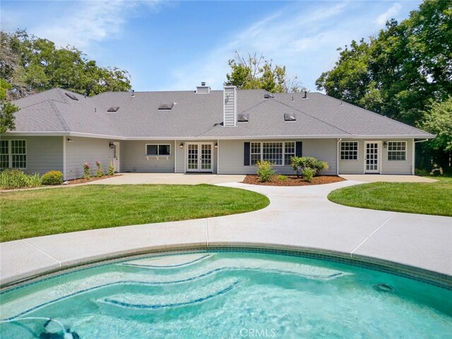 back of house featuring french doors, a yard, and a patio