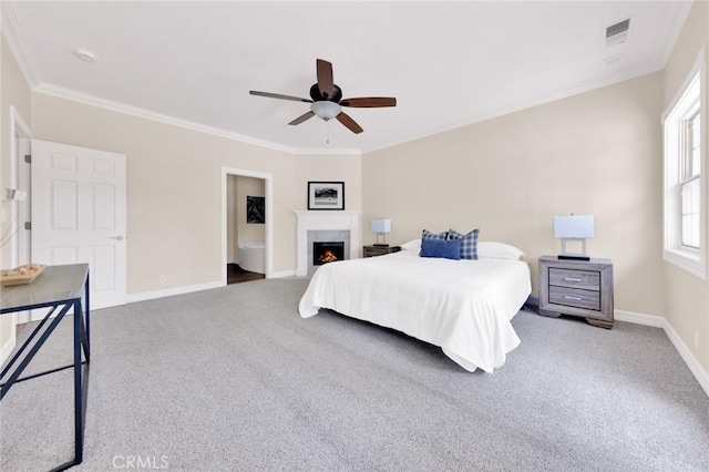 bedroom featuring ceiling fan, crown molding, and carpet