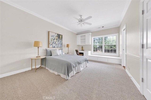 bedroom featuring ceiling fan, carpet, and ornamental molding