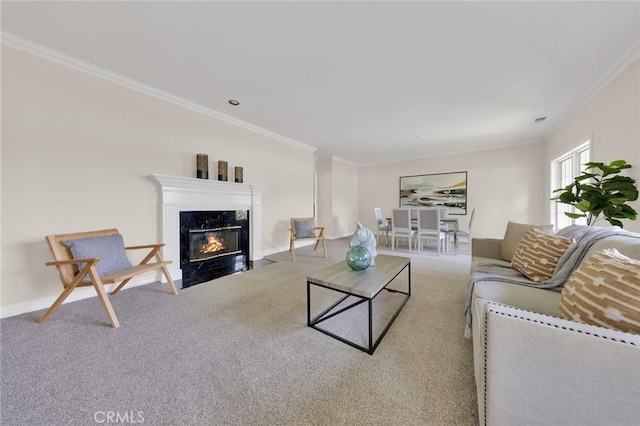 carpeted living room with a premium fireplace and ornamental molding