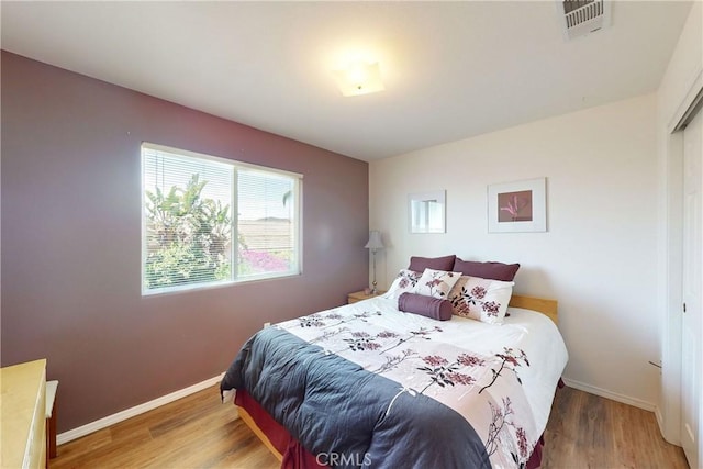 bedroom with wood-type flooring