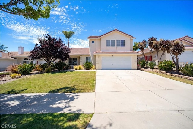 view of front of home with a front yard and a garage