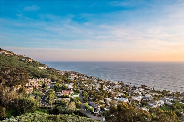 aerial view at dusk with a water view