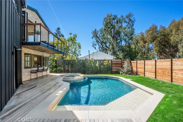 view of swimming pool featuring an in ground hot tub