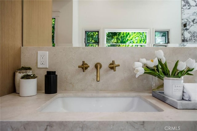 bathroom with a healthy amount of sunlight and sink