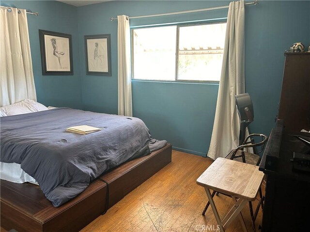 bedroom with light wood-type flooring