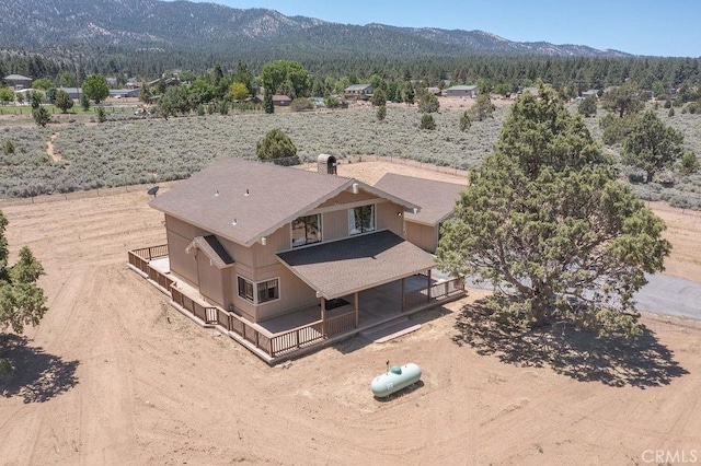 birds eye view of property featuring a mountain view