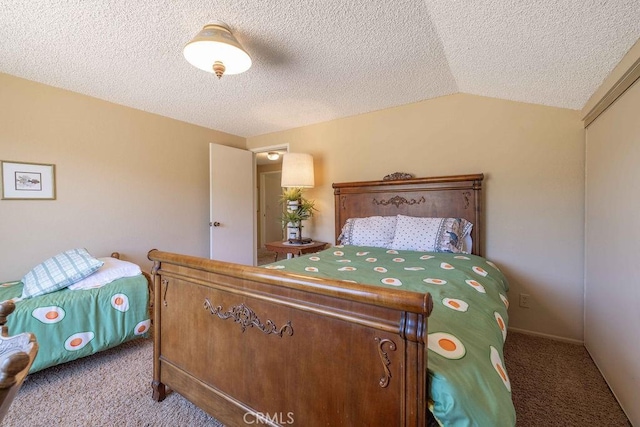 carpeted bedroom featuring a textured ceiling, a closet, and lofted ceiling