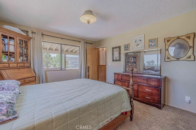 carpeted bedroom with a textured ceiling