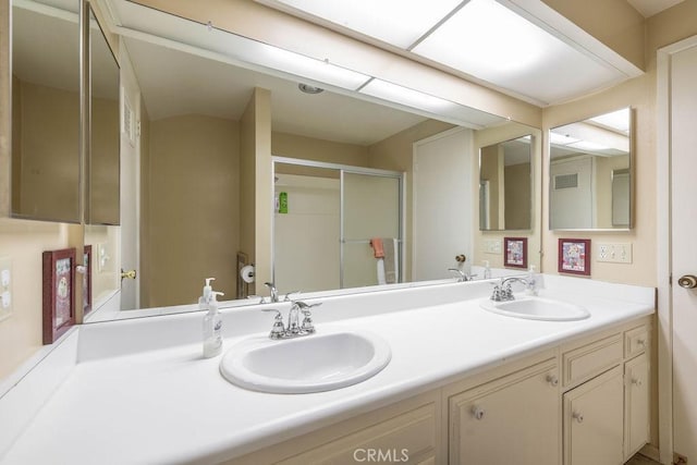 bathroom with vanity and an enclosed shower