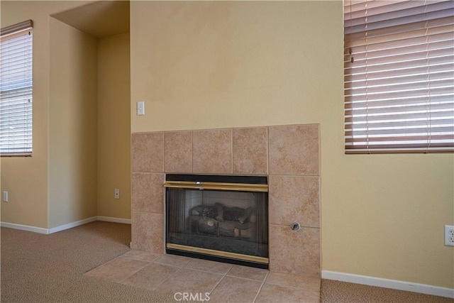 details featuring carpet and a tile fireplace