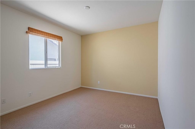 unfurnished room with carpet floors