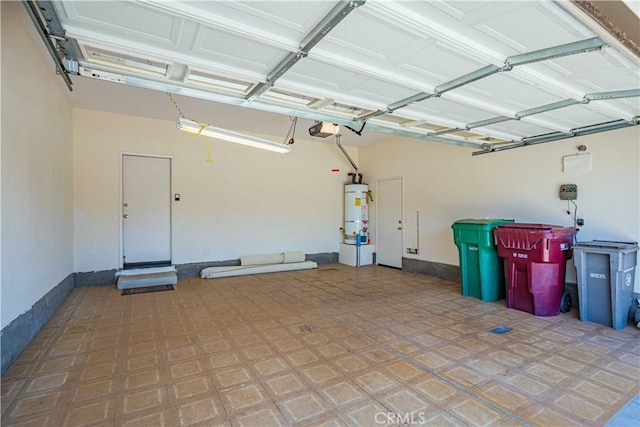 garage with a garage door opener and gas water heater