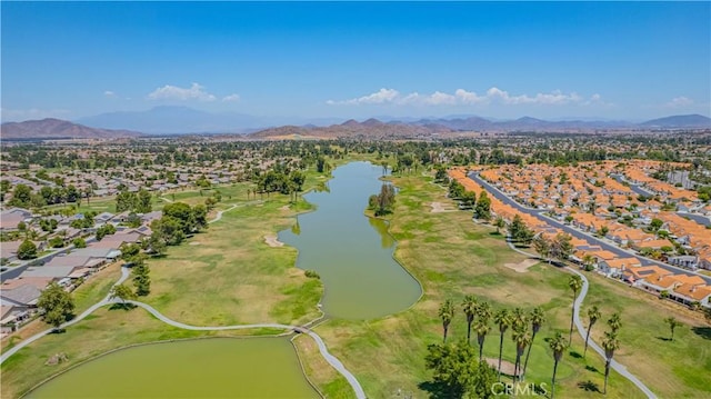 drone / aerial view with a water and mountain view