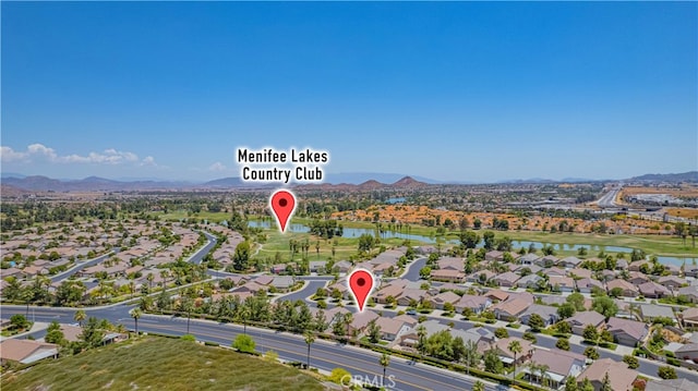 birds eye view of property featuring a water and mountain view