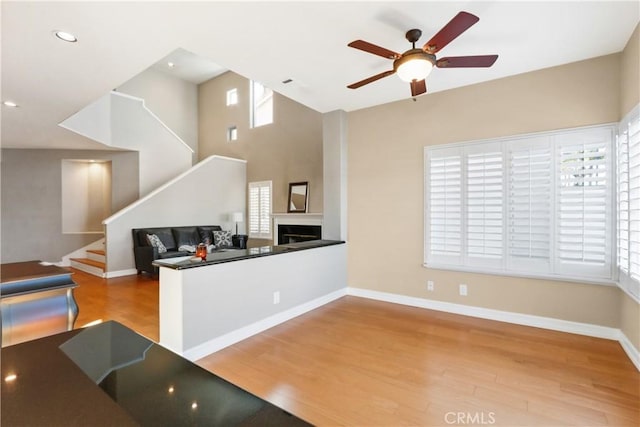 kitchen featuring a wealth of natural light, ceiling fan, and hardwood / wood-style flooring