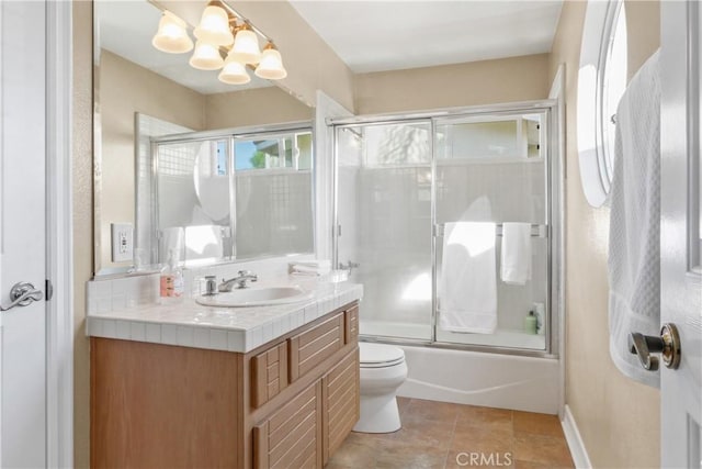 full bathroom featuring vanity, tile patterned floors, toilet, enclosed tub / shower combo, and a chandelier