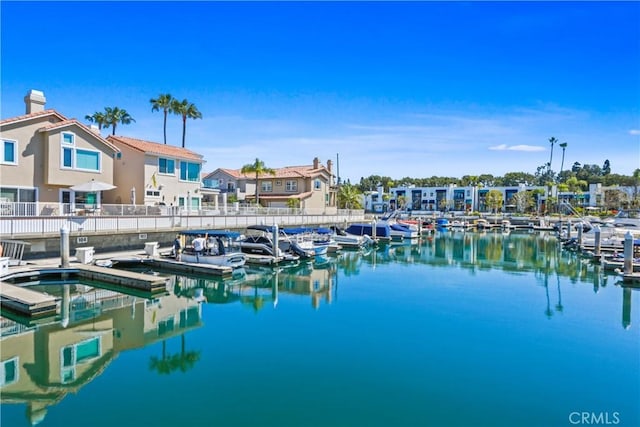 exterior space featuring a boat dock and a water view