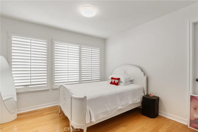 bedroom featuring wood-type flooring