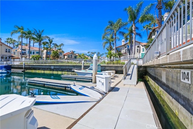 dock area with a water view