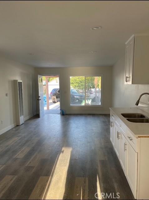 interior space with dark hardwood / wood-style floors and sink