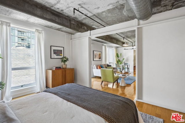 bedroom with wood-type flooring