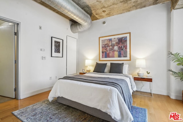 bedroom with light hardwood / wood-style floors