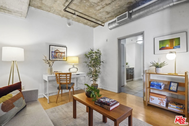 living room with light hardwood / wood-style floors