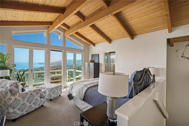 carpeted bedroom featuring access to exterior, lofted ceiling with beams, wooden ceiling, and a mountain view